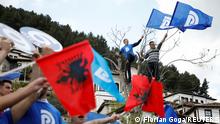 People attend an election rally held by Albania's opposition Democratic Party leader Lulzim Basha in Berat, Albania April 21, 2021. REUTERS/Florion Goga
