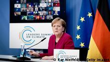 BERLIN, GERMANY - APRIL 22: German Chancellor Angela Merkel takes part in the virtual international climate summit with US President Joe Biden, on April 22, 2021 in Berlin, Germany. The meeting aims to underline the urgency and economic benefits of stronger climate action on the way to the United Nations Climate Change Conference (COP26) in Glasgow in November. Around 40 top international politicians take part in the summit. (Photo by Kay Nietfeld - Pool/Getty Images)