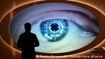 A man watches a screen that shows eye scanning at the new spy museum in Oberhausen, Germany.