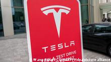 ©/MAXPPP - SHANGHAI, CHINA - APRIL 21: A Tesla test drive sign is seen outside the Tesla experience store on April 21, 2021 in Shanghai, China. (Photo by Wang Gang/VCG)