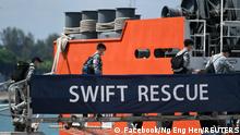 Officers board Singapore Navy's MV Swift Rescue ahead of rescue efforts for Indonesia's missing submarine KRI Nanggala-402, in Singapore April 21, 2021, in this image obtained from social media. Facebook/Ng Eng Hen/via REUTERS THIS IMAGE HAS BEEN SUPPLIED BY A THIRD PARTY. MANDATORY CREDIT. NO RESALES. NO ARCHIVES.