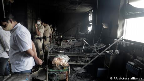 People inspect an ICU ward after a fire broke out in Vijay Vallabh COVID-19 hospital at Virar, near Mumbai