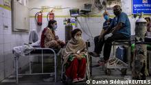 15.04.21 *** Patients suffering from the coronavirus disease (COVID-19) get treatment at the casualty ward in Lok Nayak Jai Prakash (LNJP) hospital, amidst the spread of the disease in New Delhi, India April 15, 2021. REUTERS/Danish Siddiqui