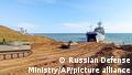 This handout photo taken from a video released on Friday, April 23, 2021 by Russian Defense Ministry Press Service shows, Russian military's armored vehicles roll into landing vessels after drills in Crimea. Russian Defense Minister Sergei Shoigu on Thursday ordered troops back to their permanent bases after a massive military buildup that caused Ukrainian and Western concerns. (Russian Defense Ministry Press Service via AP)
