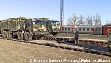 This handout photo taken from a video released on Friday, April 23, 2021 by Russian Defense Ministry Press Service shows, Russian military trucks are readied for loading after drills in Crimea. Russian Defense Minister Sergei Shoigu on Thursday ordered troops back to their permanent bases after a massive military buildup that caused Ukrainian and Western concerns. (Russian Defense Ministry Press Service via AP)