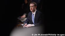 Facebook founder and CEO Mark Zuckerberg testifies during a Senate Commerce, Science and Transportation Committee and Senate Judiciary Committee joint hearing about Facebook on Capitol Hill in Washington, DC, April 10, 2018.
Facebook chief Mark Zuckerberg apologized to US lawmakers Tuesday for the leak of personal data on tens of millions of users as he faced a day of reckoning before a Congress mulling regulation of the global social media giant.In his first-ever US congressional appearance, the Facebook founder and chief executive sought to quell the storm over privacy and security lapses at the social network that have angered lawmakers and Facebook's two billion users.
/ AFP PHOTO / JIM WATSON (Photo credit should read JIM WATSON/AFP via Getty Images)