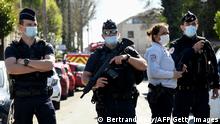 French police officials block off a street near the police station in Rambouillet, south-west of Paris, on April 23, 2021, after a woman was stabbed to death. - A female police employee was stabbed to death by a Tunisian man at a police station southwest of Paris on Friday, the local prosecutor's office and a police source told AFP. The attacker was fatally wounded when an officer opened fire on him at the station in Rambouillet, a wealthy commuter town about 60 kilometres from Paris, a police source told AFP. (Photo by Bertrand GUAY / AFP) (Photo by BERTRAND GUAY/AFP via Getty Images)