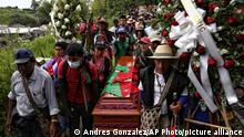 Mourners accompany the coffin that contain the remains of Indigenous leader Sandra Liliana Pena, in a funeral service in El Porvenir, Colombia, Friday, April 23, 2021. Pena, the governor of the La Laguna-Siberia reservation in Cauca state, was killed Tuesday morning by unidentified gunmen men near her home. (AP Photo/Andres Gonzalez)