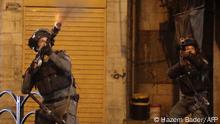 An Israeli soldier fires during clashes with Palestinian youth in the city center of the occupied West Bank town of Hebron on April 24, 2021, following a protest in support of Palestinian demonstration in Israeli-annexed east Jerusalem. - Israeli Prime Minister Benjamin Netanyahu on April 24, 2021, called for calm on all sides after several nights of unrest in Israeli-annexed east Jerusalem. There have been nightly disturbances since the start of the Muslim holy month of Ramadan on April 13, amid Palestinian anger over police blocking off access to the promenade around the walls of the Old City and a ban on gatherings. (Photo by HAZEM BADER / AFP)