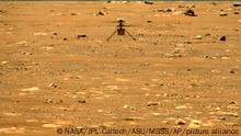 In this image made available by NASA, the Mars Ingenuity helicopter hovers above the surface of the planet during its second flight on Thursday, April 22, 2021. (NASA/JPL-Caltech/ASU/MSSS via AP)