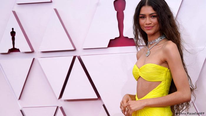 Zendaya at the 2021 Oscars in a yellow dress.