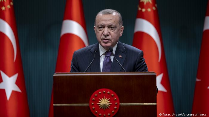 Turkish President Recep Tayyip Erdogan behind lectern