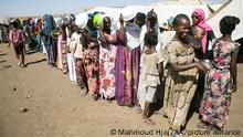 KASSALA, SUDAN - DECEMBER 14: Ethiopians, who fled the conflict in the Tigray region in northern Ethiopia due to the clashes in the operation launched by the Federal Government Forces against the Tigray People's Liberation Front (TPLF), wait to reiceve food in Hamdayit camp after reaching Kassala State, Sudan on December 14, 2020. The number of refugees in neighboring Sudan has been reported to have risen to almost 50 thousand. Mahmoud Hjaj / Anadolu Agency