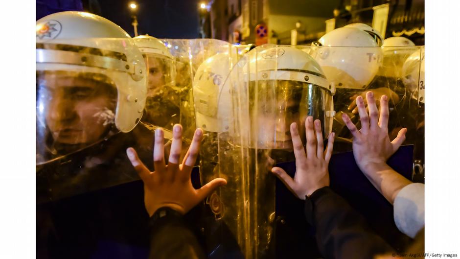 Demonstrators in Istanbul putting hands on shields of riot police. Photo: Yasin Akgul, Turkey