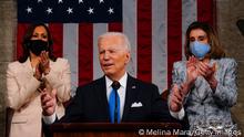 WASHINGTON, DC - APRIL 28: U.S. President Joe Biden addresses a joint session of Congress as Vice President Kamala Harris (L) and Speaker of the House U.S. Rep. Nancy Pelosi (D-CA) (R) look on in the House chamber of the U.S. Capitol April 28, 2021 in Washington, DC. On the eve of his 100th day in office, Biden spoke about his plan to revive America’s economy and health as it continues to recover from a devastating pandemic. He delivered his speech before 200 invited lawmakers and other government officials instead of the normal 1600 guests because of the ongoing COVID-19 pandemic. (Photo by Melina Mara-Pool/Getty Images)