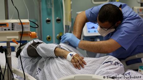 A nurse monitors the health of a COVID-19 patient at a hospital in Gaza City