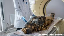 This Handout picture made available by the Warsaw Mummy Project on April 29, 2021 shows the pregnant Egyptian mummy being prepared for X-Ray images taken on December 15, 2015 at a medical centre in Otwock near Warsaw, Poland. - Polish scientists said on April 29, 2021 they have discovered the world's first pregnant Egyptian mummy while carrying out scans on the 2,000-year-old remains kept at the National Museum in Warsaw. (Photo by Aleksander LEYDO / Warsaw Mummy Project / AFP) / RESTRICTED TO EDITORIAL USE - MANDATORY CREDIT AFP PHOTO / Warsaw Mummy Project / Aleksander LEYDO - NO MARKETING - NO ADVERTISING CAMPAIGNS - DISTRIBUTED AS A SERVICE TO CLIENTS