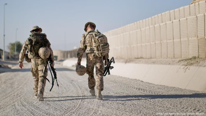 two NATO soldiers walking