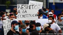 People hold signs reading Respect for the constitution, as they protest against the removal of Supreme Court judges and the Attorney General by Salvadoran congress, in San Salvador, El Salvador, May 2, 2021. REUTERS/ Jose Cabezas
