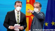 03.05.21 *** German Foreign Minister Heiko Maas, right, and the Foreign Minister of North Macedonia, Bujar Osmani, talk after a joint news conference as part of a meeting in Berlin, Germany May 3, 2021. Michael Sohn/Pool via REUTERS