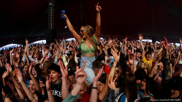 People attend a test music festival as part of a national research programme assessing the risk of COVID-19 transmission in Liverpool,