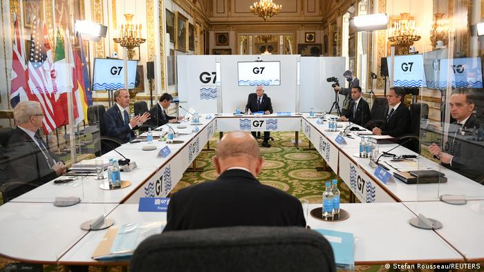 G7 members meet behind Perspex glass in London