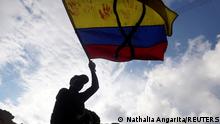 May 4, 2021***
A demonstrator waves a Colombian flag during a protest against poverty and police violence, in Bogota, Colombia May 4, 2021. REUTERS/Nathalia Angarita NO RESALES. NO ARCHIVES TPX IMAGES OF THE DAY