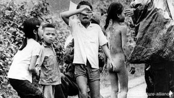 Injured Vietnamese children cry after napalm attack on their village