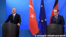 German Foreign Minister Heiko Maas (R) and the Foreign Minister of Turkey Mevlut Cavusoglu give a joint press conference following their meeting in the foreign office in Berlin, Germany, on May 6, 2021. (Photo by ANNEGRET HILSE / POOL / AFP)