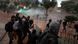 Demonstrators clash with police officers during a protest against poverty and police violence in Bogota Demonstrators clash with police officers during a protest against poverty and police violence in Bogota