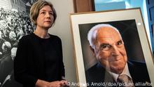 17 July 2018, Germany, Speyer: Widow of ex-Chancellor Helmut Kohl, Maike Kohl-Richter, standing next to a portrait of her husband that she presented to the museum. Kohl died on the 16 June 2017 at the age of 87. It is the last offical photo of the statesman that will commemorate him at a European act of state in Strassburg and at a subsequent requiem in the Speyer cathedral. The photo was produced by his widow and will be shown at a special exhibition in the historical museum in Rhineland-Platinate. Photo: Andreas Arnold/dpa