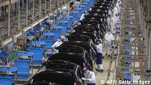 This photo taken on April 15, 2021 shows employees working on an assembly line at an auto plant of Dongfeng Honda in Wuhan in China's central Hubei province, as data on April 16 shows the country's economy expanded at its fastest pace on record during the first quarter. - - China OUT (Photo by STR / AFP) / China OUT (Photo by STR/AFP via Getty Images)