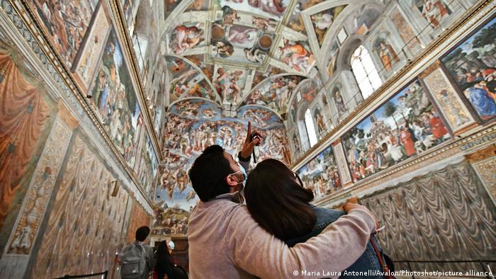 Visitors admire the Sistine Chapel in the Vatican Museums