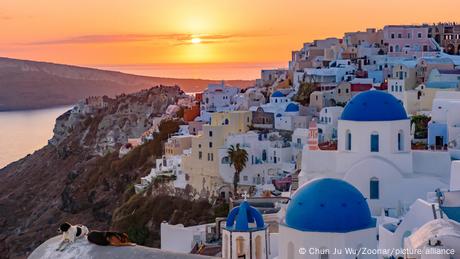 View of rooftops on Santorini, Greece at sunset 