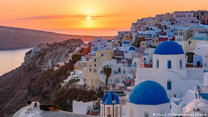 View of rooftops on Santorini, Greece at sunset 