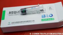 A syringe and a box of China's Sinopharm coronavirus disease (COVID-19) vaccine are seen at a sport centre, as the country continues its mass inoculation campaign, in Stip, North Macedonia May 6, 2021. REUTERS/Ognen Teofilovski