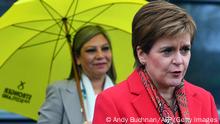 Scotland's First Minister and leader of the Scottish National Party (SNP), Nicola Sturgeon (R) speaks to the media as she congratulates SNP candidate Kaukab Stewart (R) after she was elected MSP for Glasgow Kelvin in the Scottish Parliamentary Election, in Glasgow on May 8, 2021. (Photo by Andy Buchanan / AFP) (Photo by ANDY BUCHANAN/AFP via Getty Images)