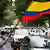 A Colombian protester waves a flag.