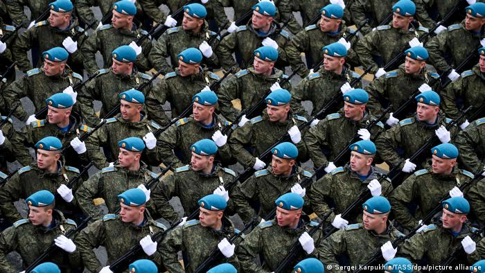 Servicemen stand in formation ahead of a military parade marking the 76th anniversary of the victory over Nazi Germany in World War II