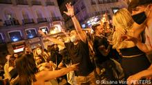 People celebrate as the state of emergency decreed by the Spanish Government to prevent the spread of the coronavirus disease (COVID-19) gets lifted at Puerta del Sol square in Madrid, Spain, May 9, 2021. REUTERS/Susana Vera