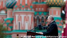 Russian President Vladimir Putin delivers his speech during the Victory Day military parade in Moscow, Russia, Sunday, May 9, 2021, marking the 76th anniversary of the end of World War II in Europe. (Mikhail Metzel, Sputnik, Kremlin Pool Photo via AP)