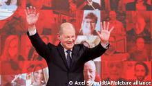 German Social Democratic Party (SPD) candidate for chancellor Olaf Scholz cheers on stage during a party meeting in Berlin, Germany, Sunday, May 9, 2021. (Axel Schmidt/Pool Photo via AP)