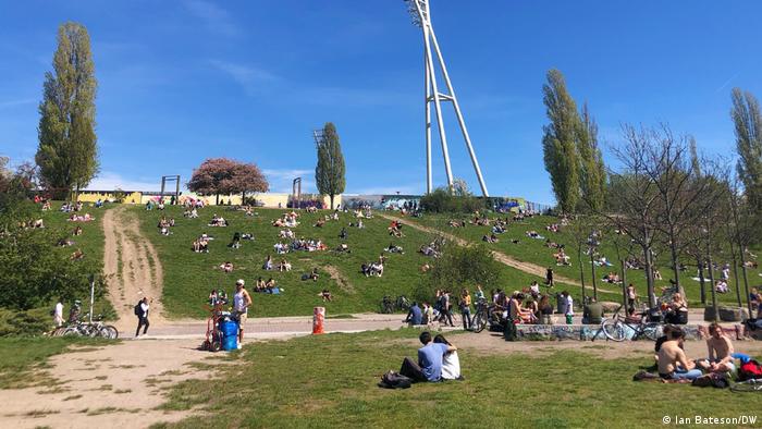 People congregated in Mauerpark on a sunny day in Berlin