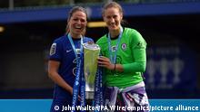 Chelsea v Reading - FA Women's Super League - Kingsmeadow. Chelsea players celebrate with the FA Women's Super League trophy after clinching the title at Kingsmeadow, London. Picture date: Sunday May 9, 2021. See PA story SOCCER Chelsea Women. Photo credit should read: John Walton/PA Wire. RESTRICTIONS: Editorial use only, no commercial use without prior consent from rights holder. URN:59669509