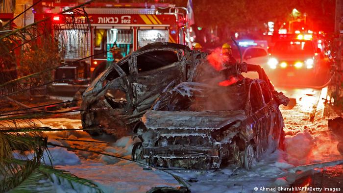 Burnt cars near Tel Aviv following rocket fire from Gaza