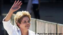 BRASILIA, BRAZIL - MAY 12: Suspended Brazilian President Dilma Rousseff waves before speaking to supporters at the Planalto presidential palace after the Senate voted to accept impeachment charges against Rousseff on May 12, 2016 in Brasilia, Brazil. Rousseff has been suspended from her presidential duties and will face a Senate trial for alleged manipulation of government accounts. (Photo by Mario Tama/Getty Images)
