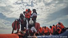 03.09.2019***A person is transferred onto a rescue boat some 14 nautical miles from the coast of Libya in Mediterranean Sea, Sunday, Sept. 8, 2019. Humanitarian groups SOS Mediterranee and Doctors Without Borders have successfully rescued 50 migrants and brought them aboard the Ocean Viking. (AP Photo/Renata Brito)