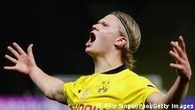 BERLIN, GERMANY - MAY 13: Erling Haaland of Borussia Dortmund celebrates his team's second goal during the DFB Cup final match between RB Leipzig and Borussia Dortmund at Olympic Stadium on May 13, 2021 in Berlin, Germany. Sporting stadiums around Germany remain under strict restrictions due to the Coronavirus Pandemic as Government social distancing laws prohibit fans inside venues resulting in games being played behind closed doors. (Photo by C - Pool/Getty Images)