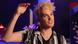Singer Jendrik Sigwart with his hand up in the air. Singer Jendrik Sigwart with his hand up in the air.