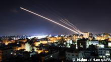 Rockets are launched from Gaza City, controlled by the Palestinian Hamas movement, towards Israel early on May 15, 2021. - Israel faced a widening conflict on May 14, as deadly violence erupted across the West Bank amid a massive aerial bombardment in Gaza and unprecedented unrest among Arabs and Jews inside the country. (Photo by MAHMUD HAMS / AFP)